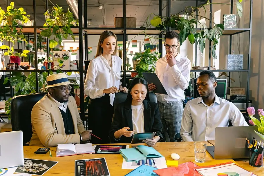 A diverse team collaborating on a project in a modern office